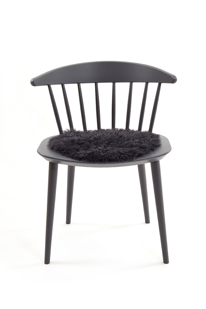 Curly Sheepskin Seat Pad in Dark Grey chair