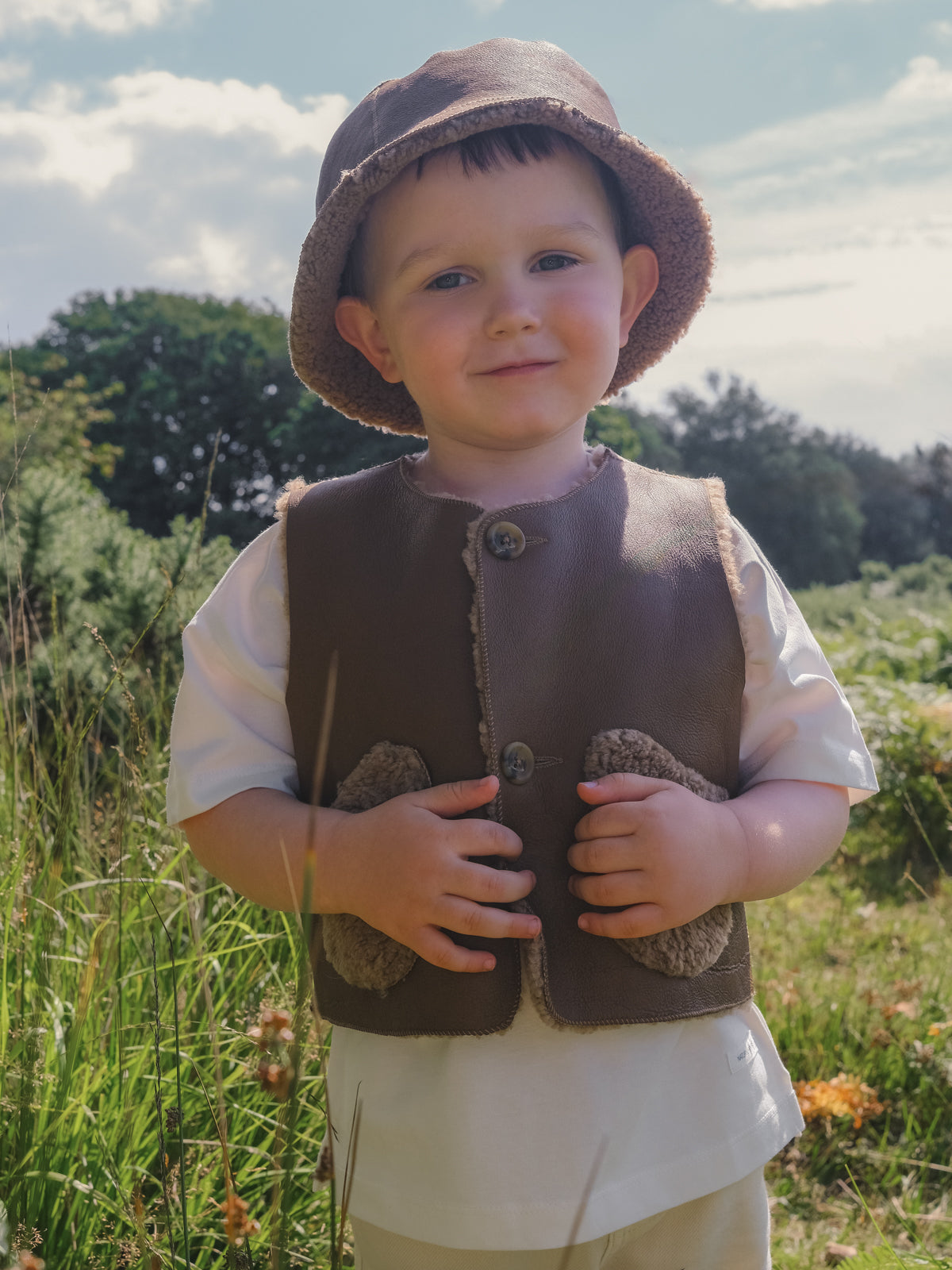 Albie Camel Kids Teddy Shearling Gilet | Kids | Gushlow & Cole - on boy model outside