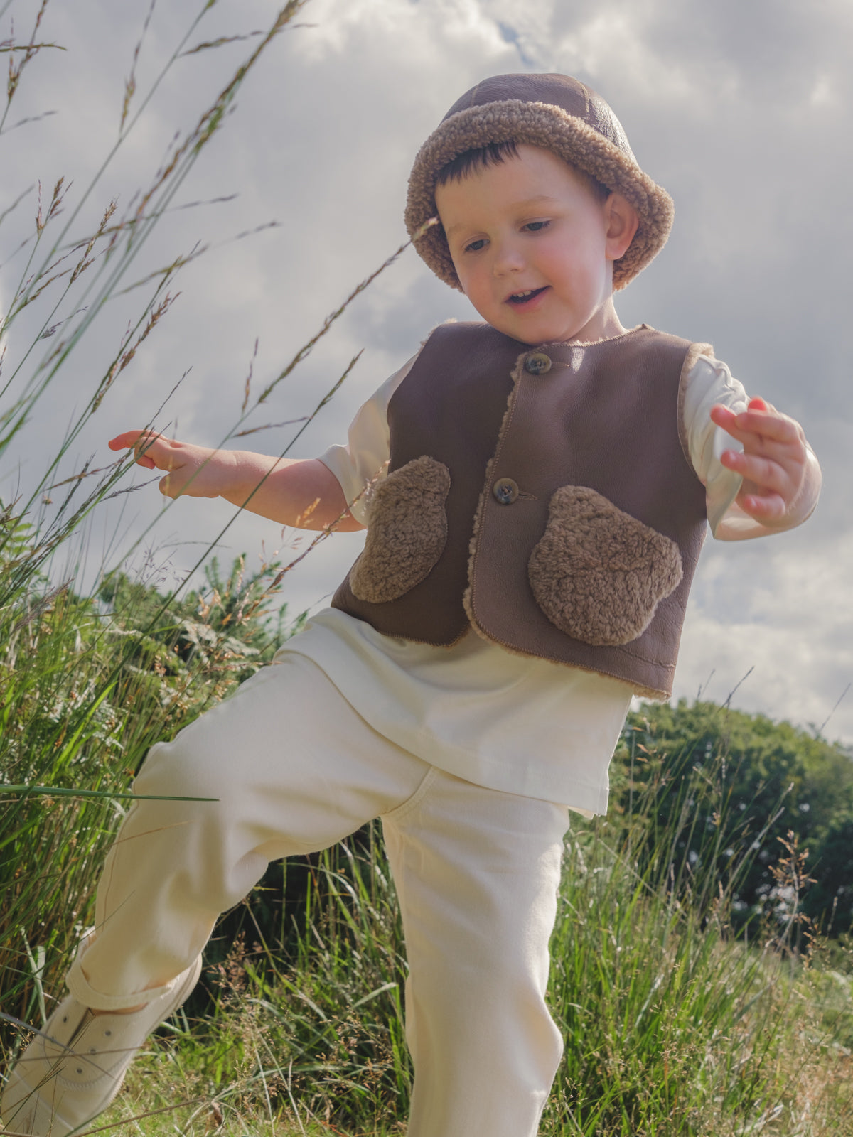 Albie Camel Kids Teddy Shearling Gilet | Kids | Gushlow & Cole - on boy model outside