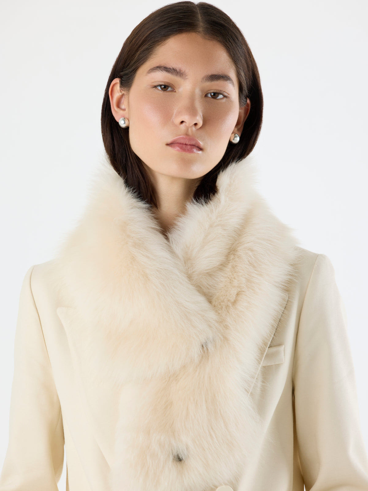 woman wearing Baby Button Cream Shearling Scarf over cream blazer by gushlow & cole