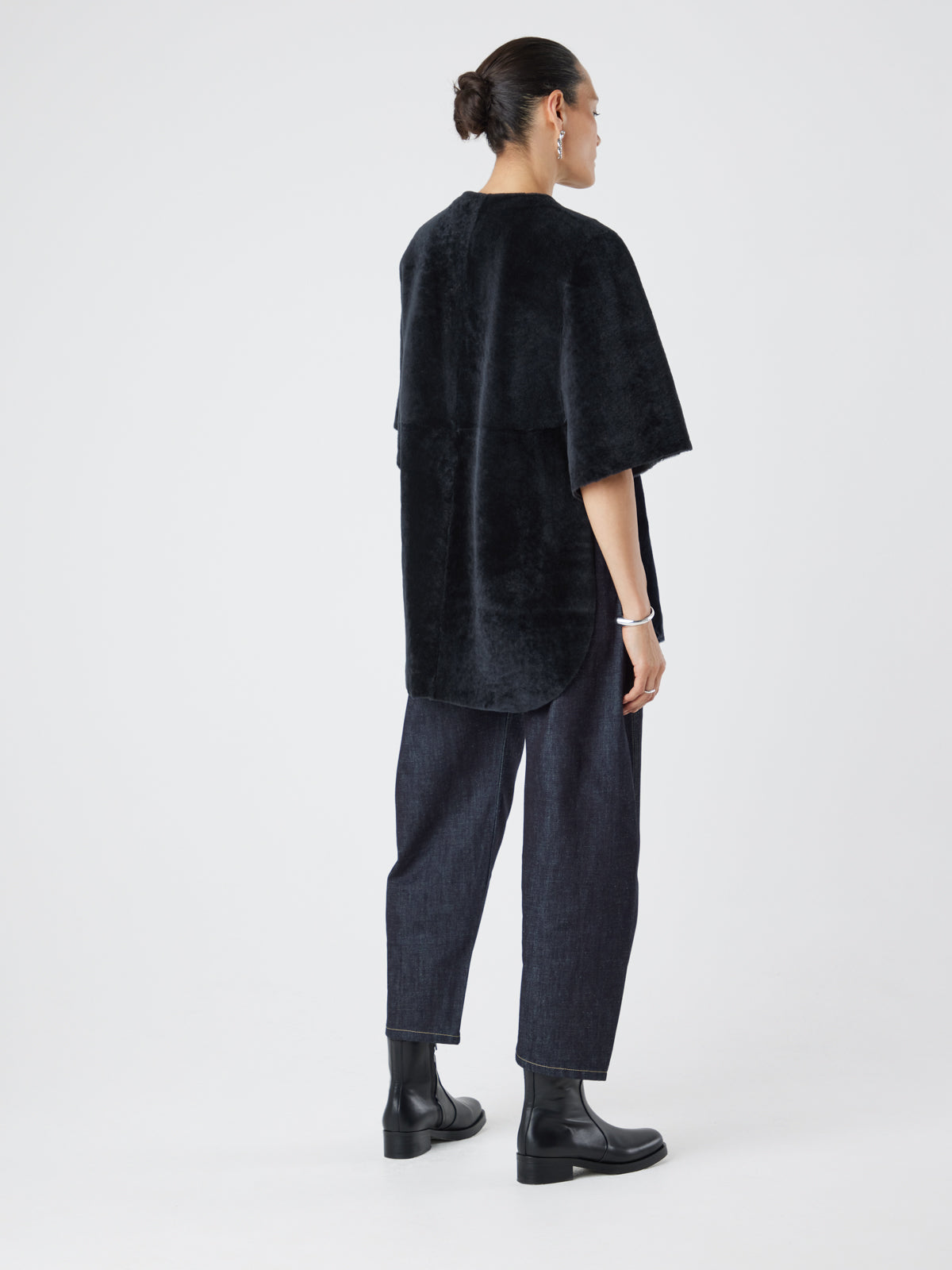 Black Collarless Shearling Cape | Womens | Gushlow & Cole- model full length back