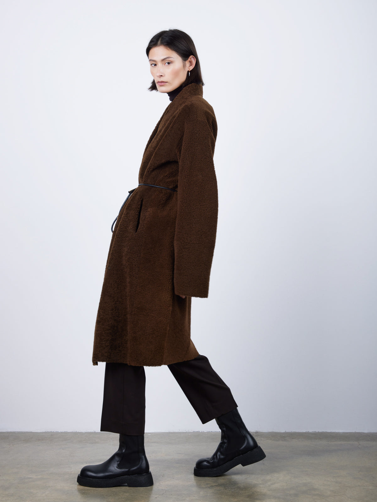 Brown Collarless Shearling Wrap Coat | Womens | Gushlow & Cole - model side with belt