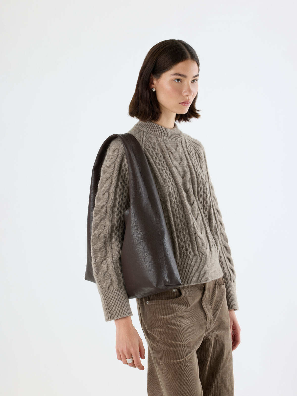 woman wearing Clara Large Leather Shoulder Bag in chocolate brown by gushlow & Cole over shoulder