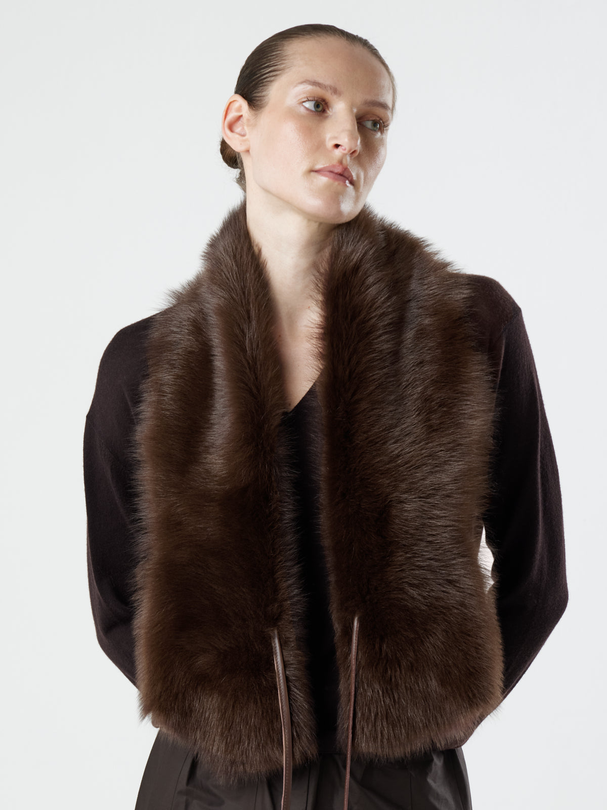 woman wearing Brown Shearling Shawl Scarf with nappa leather ties by gushlow & cole, over brown jumper on white background