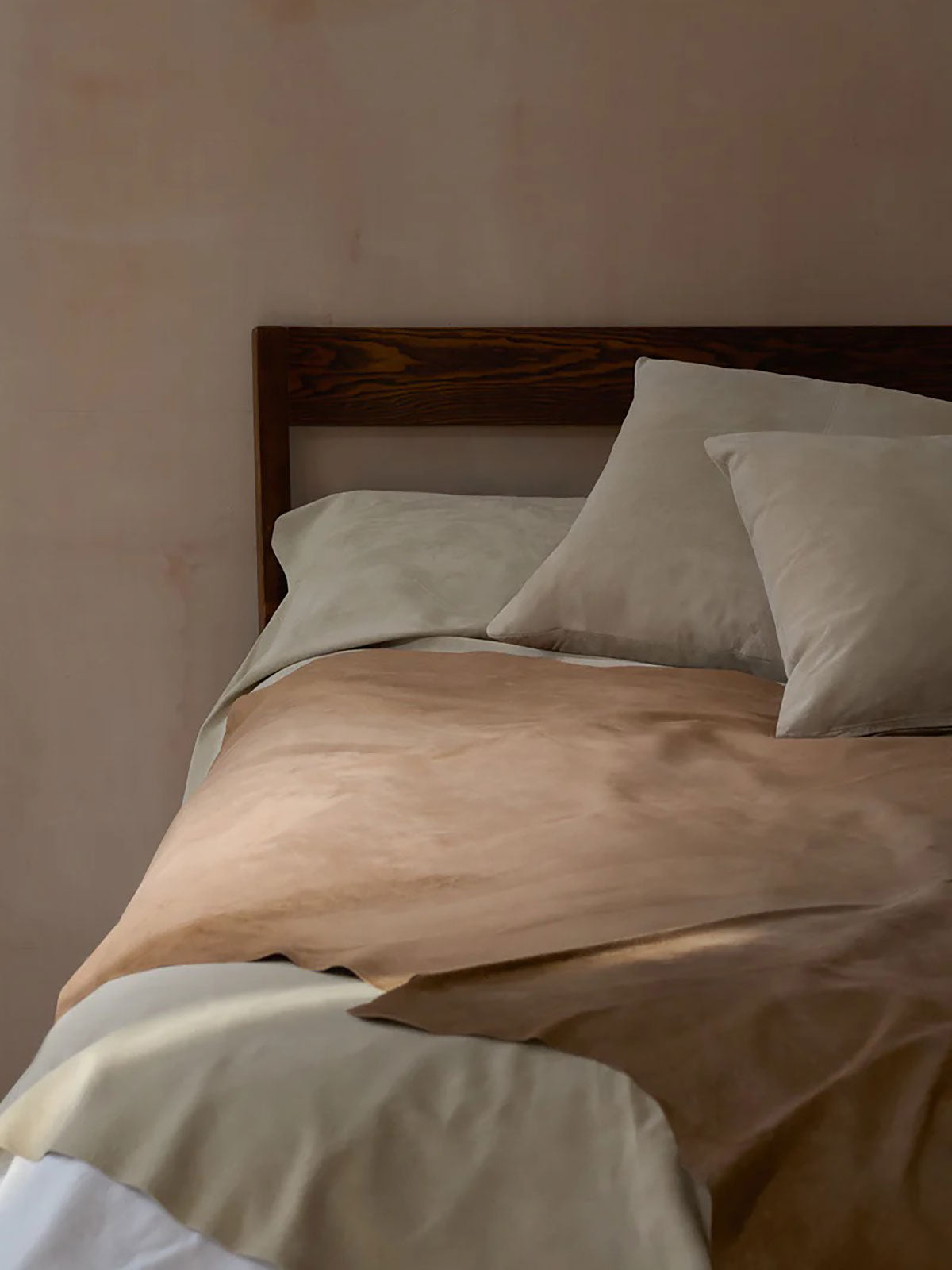 Camel Suede Throw | Home | Gushlow & Cole - lifestyle image of throw on bed with suede cushion