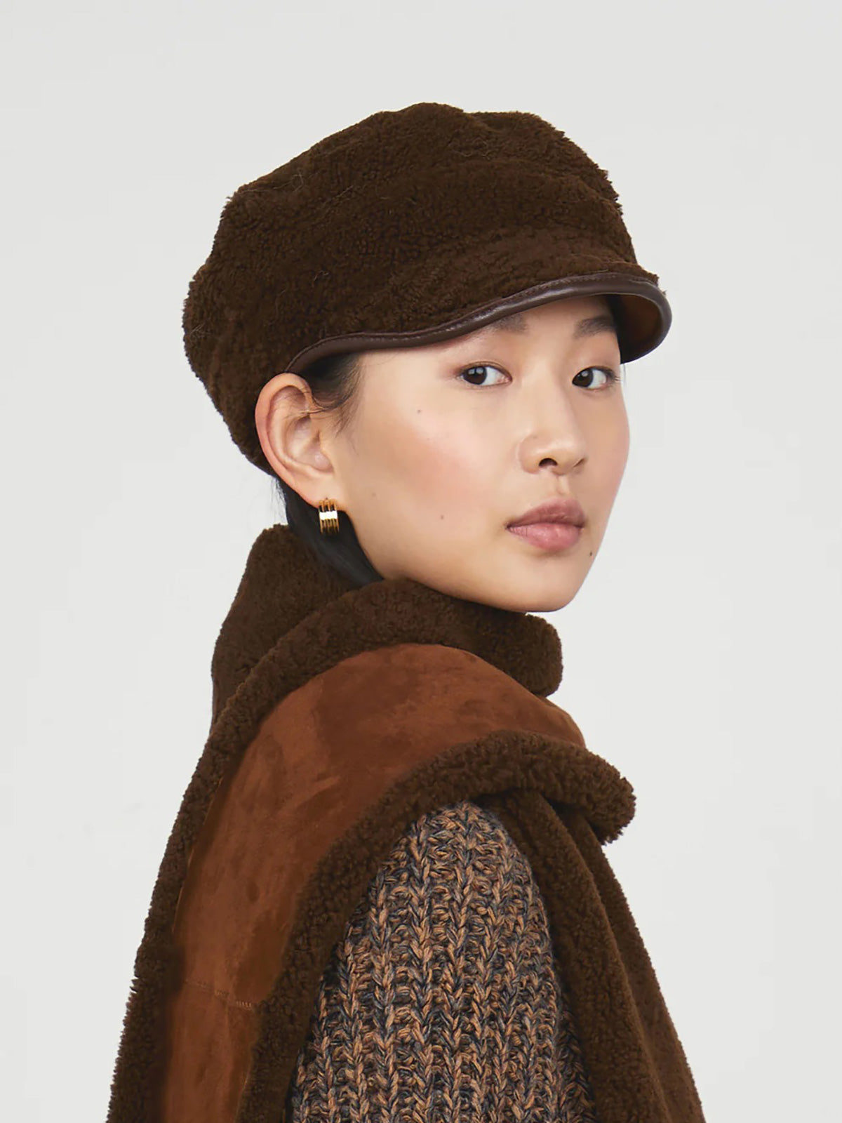 Chestnut Brown Hackney Shearling Cap gushlow and cole - model portrait side