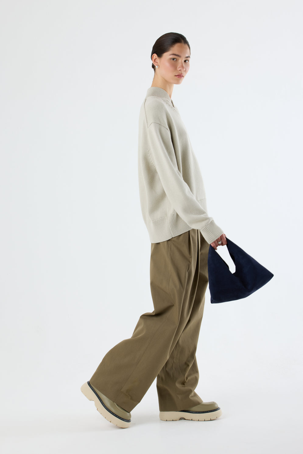 Clara Small Navy Blue Suede Shoulder Bag | Bags | Gushlow & Cole - full length model holding bag side on