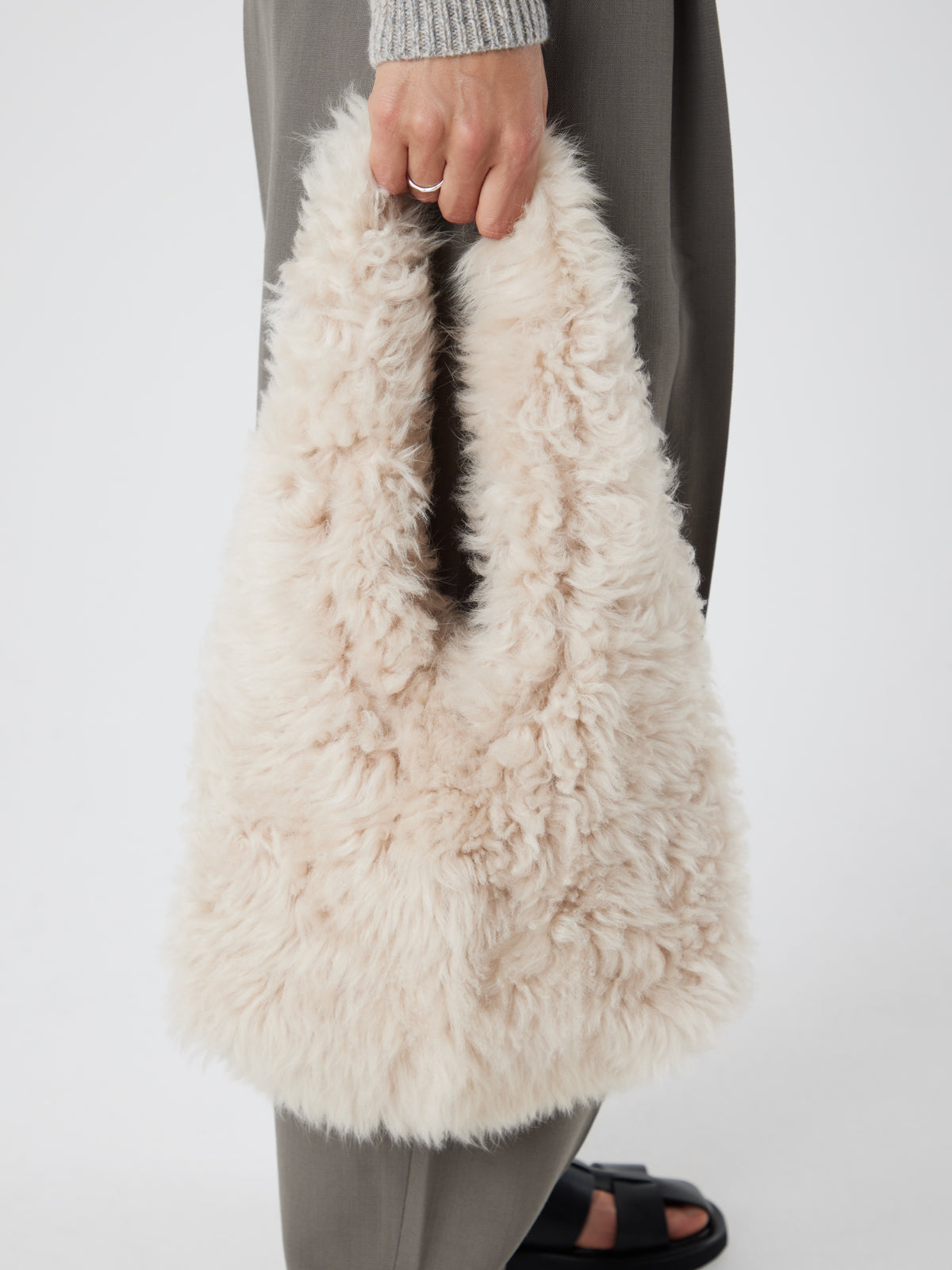 Cream Shearling Slouch Bag | Womens | Gushlow & Cole - model crop holding bag