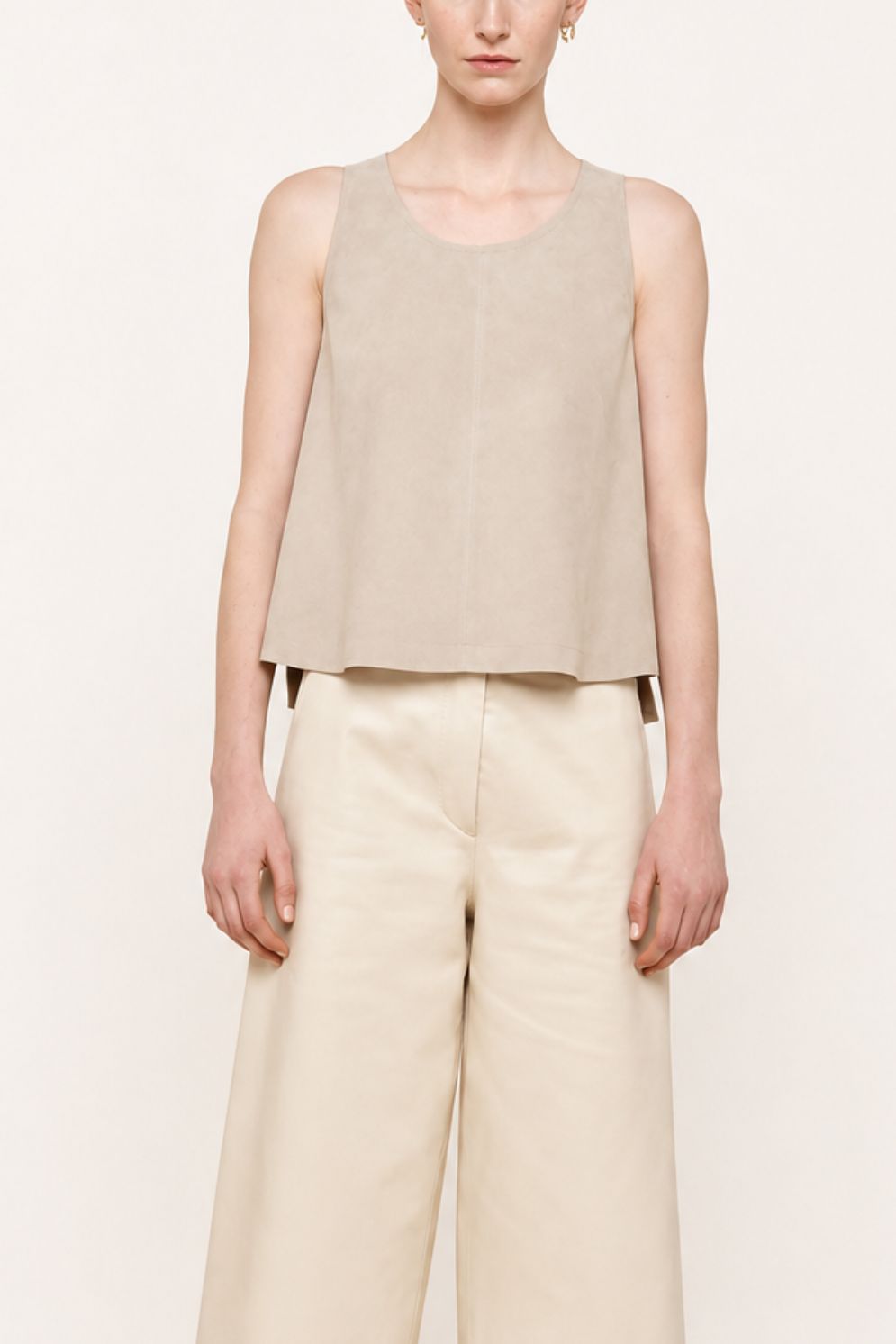 woman wearing cream suede vest top on white background by gushlow & cole