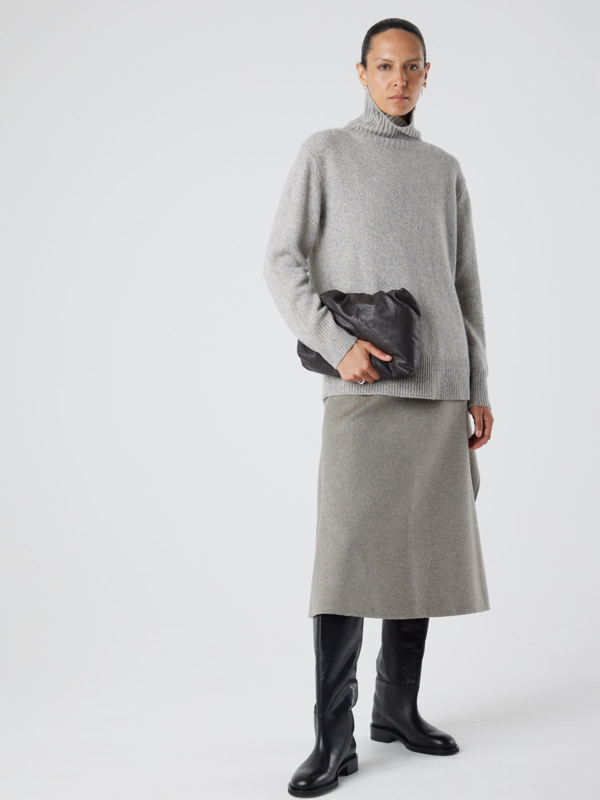 English Nappa Leather Soft English Nappa Clutch Bag in Storm Brown | Womens | Gushlow & Cole- model holding bag clutch