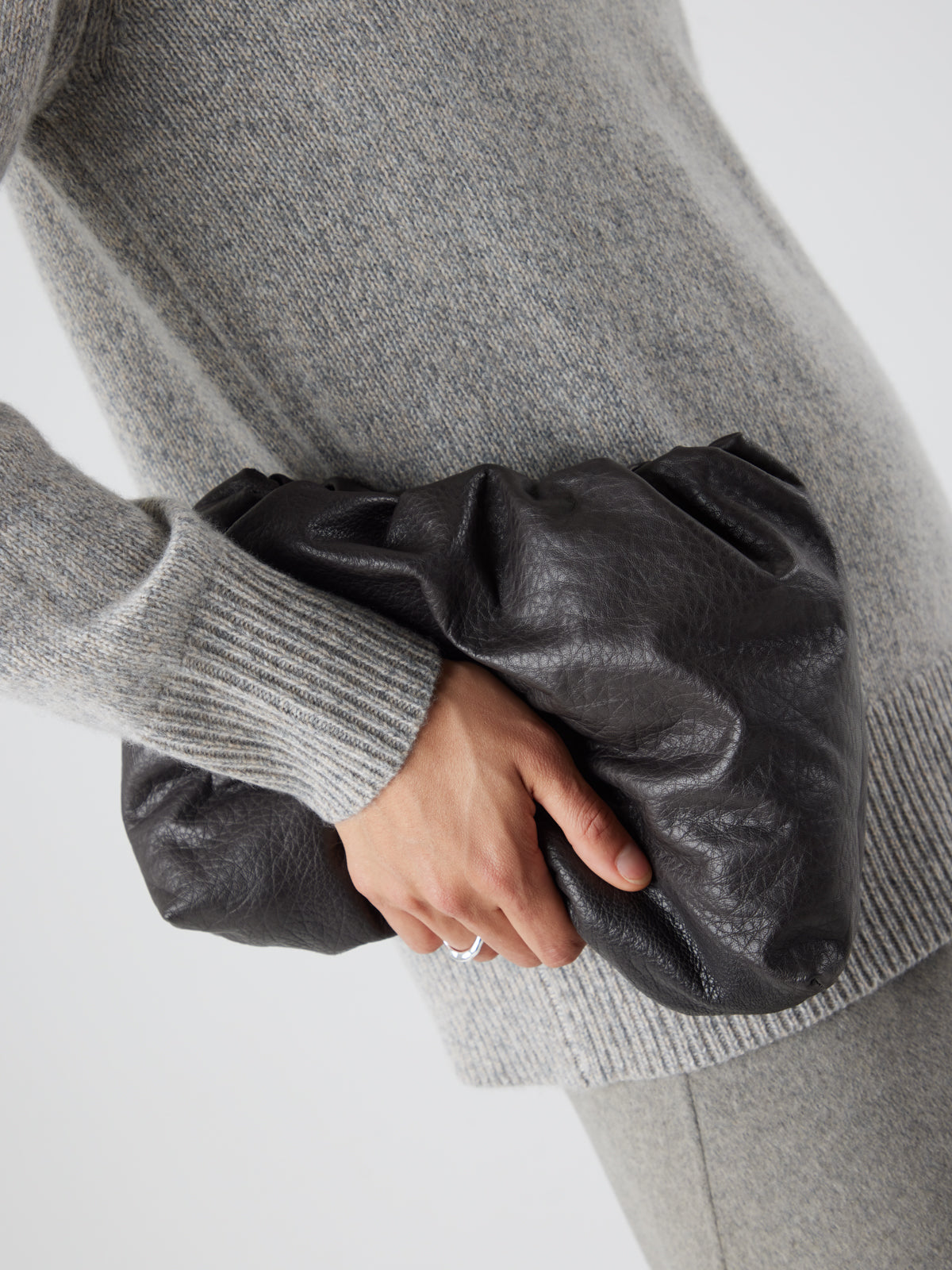 English Nappa Leather Soft English Nappa Clutch Bag in Storm Brown | Womens | Gushlow & Cole- model holding bag crop