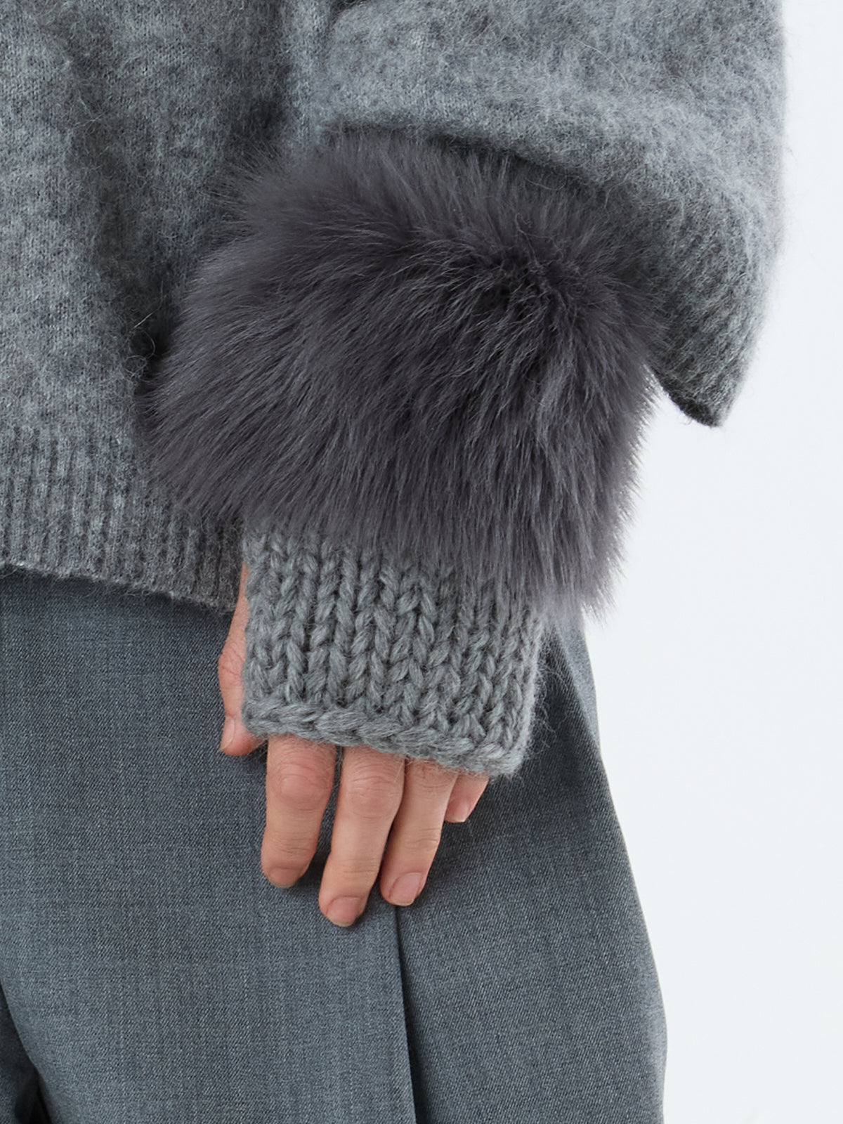 woman wearing Grey Shearling and Knit Mittens by Gushlow & Cole over grey jumper