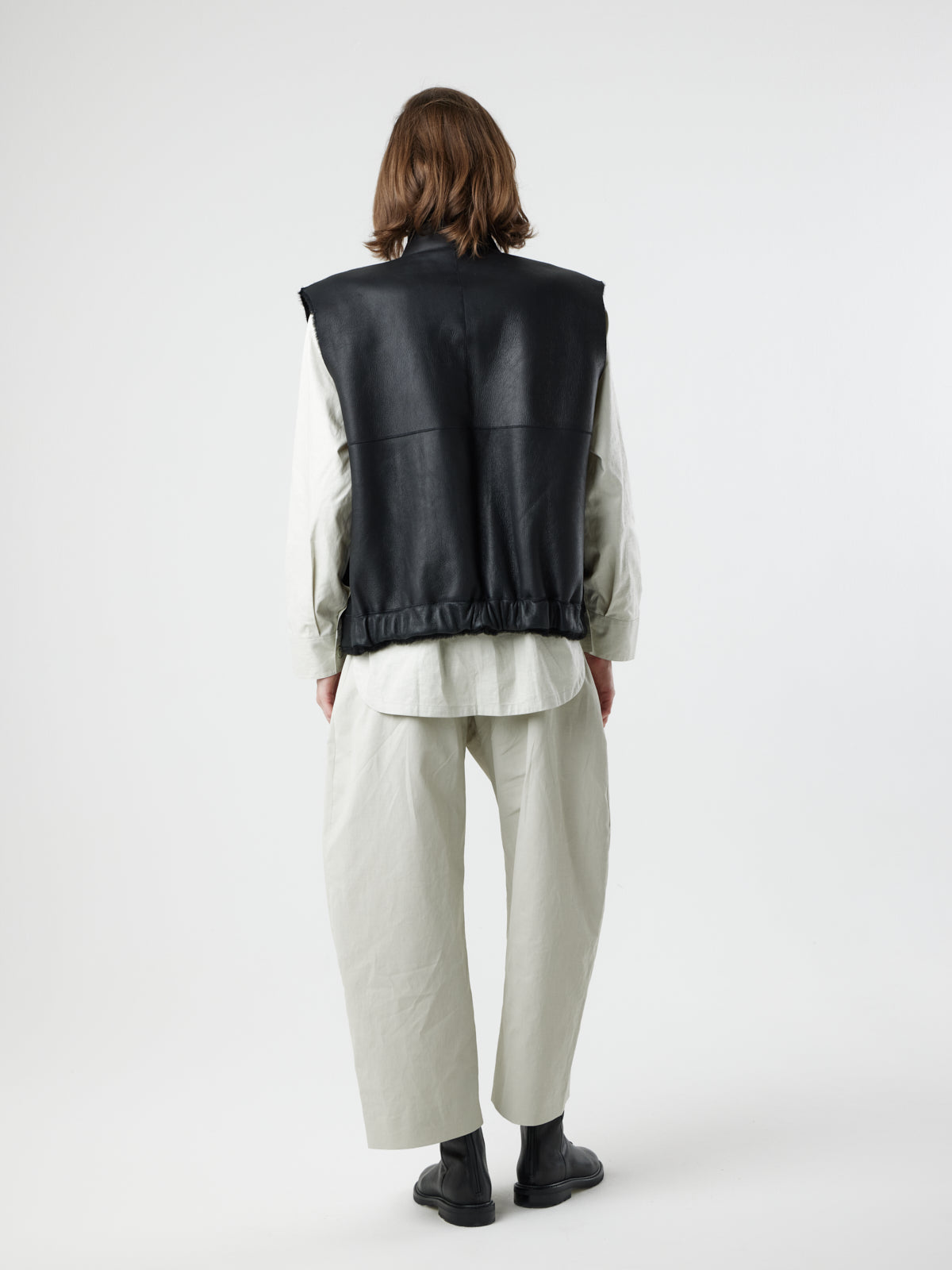back view of woman wearing Joyce Black Shearling Gilet by Gushlow and Cole