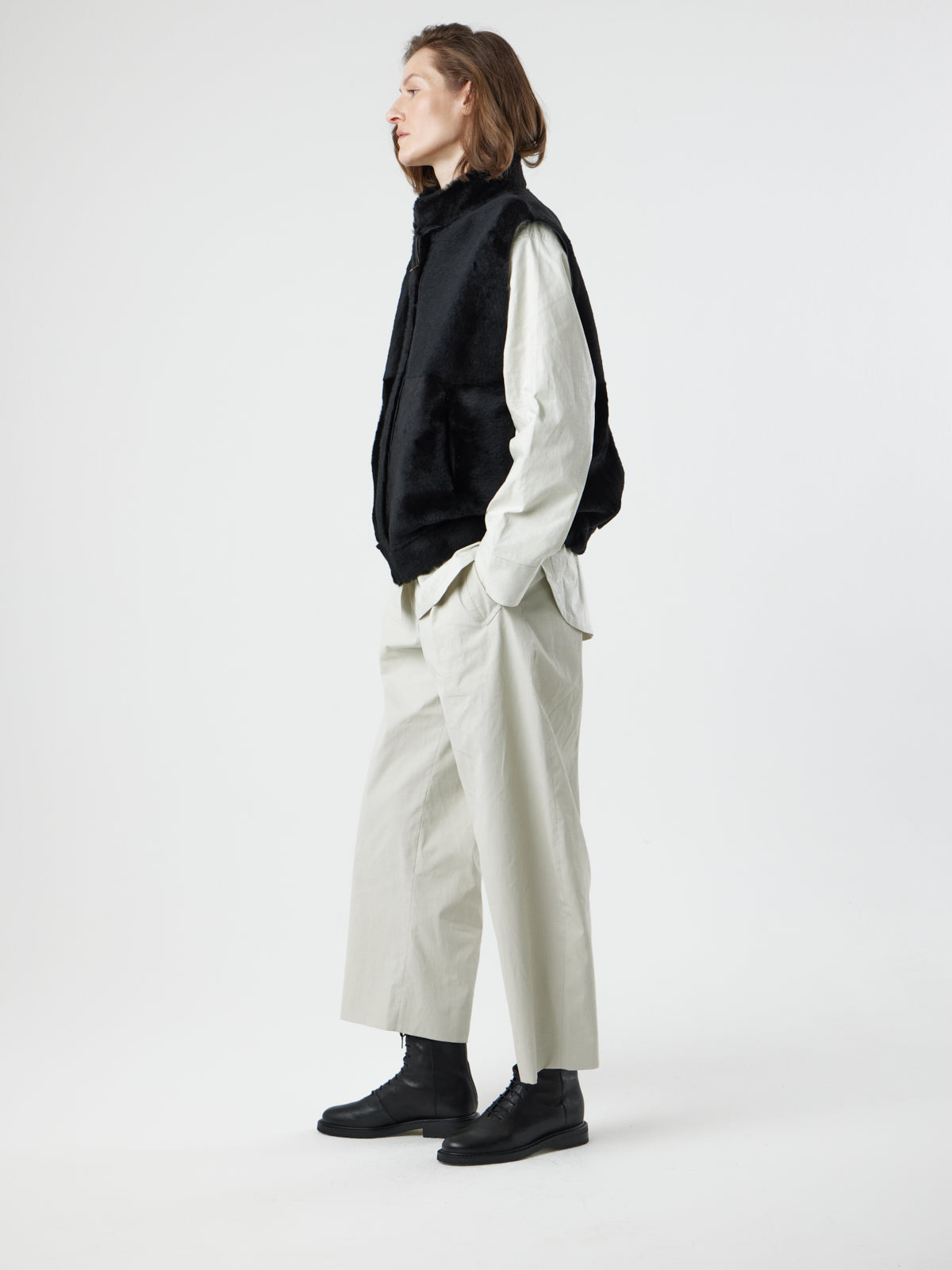 side view of woman wearing Joyce Black Shearling Gilet by Gushlow and Cole