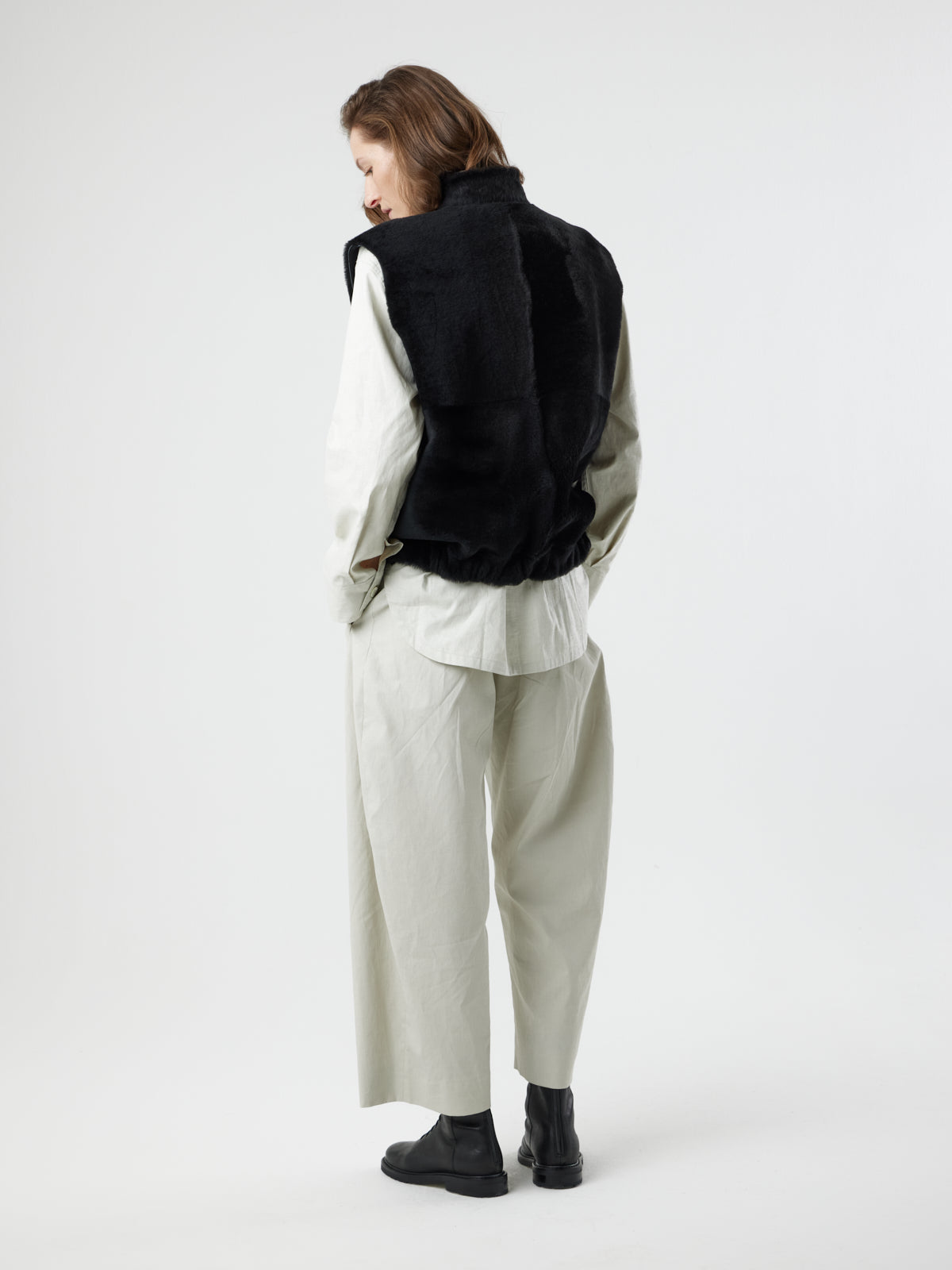 back view of woman wearing Joyce Black Shearling Gilet by Gushlow and Cole
