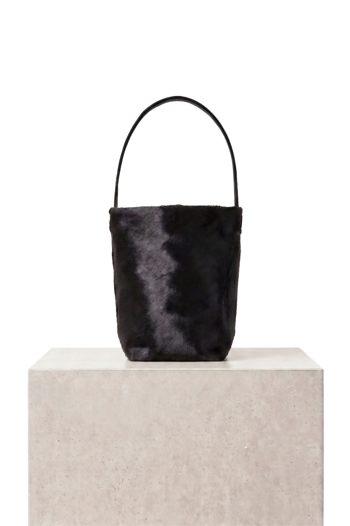 maye small black bucket tote bag by gushlow & cole on plinth