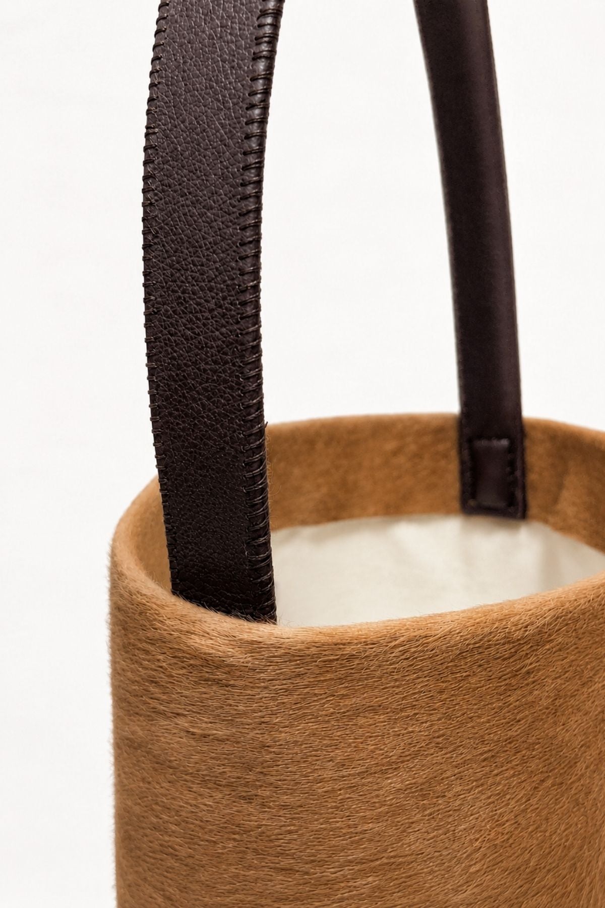 crop in of maye small camel bucket tote bag by gushlow & cole on white background