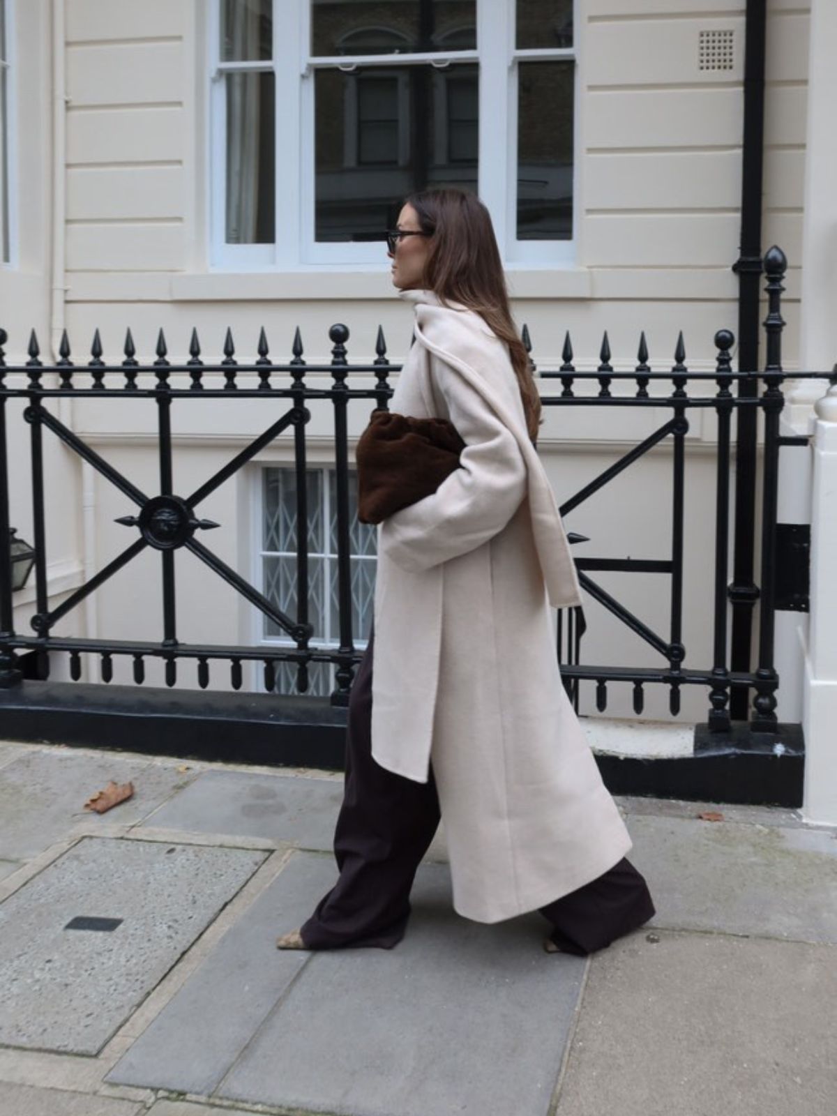 Merino Soft Shearling Clutch Bag | Womens | Gushlow & Cole - model holding bag with cream coat walking