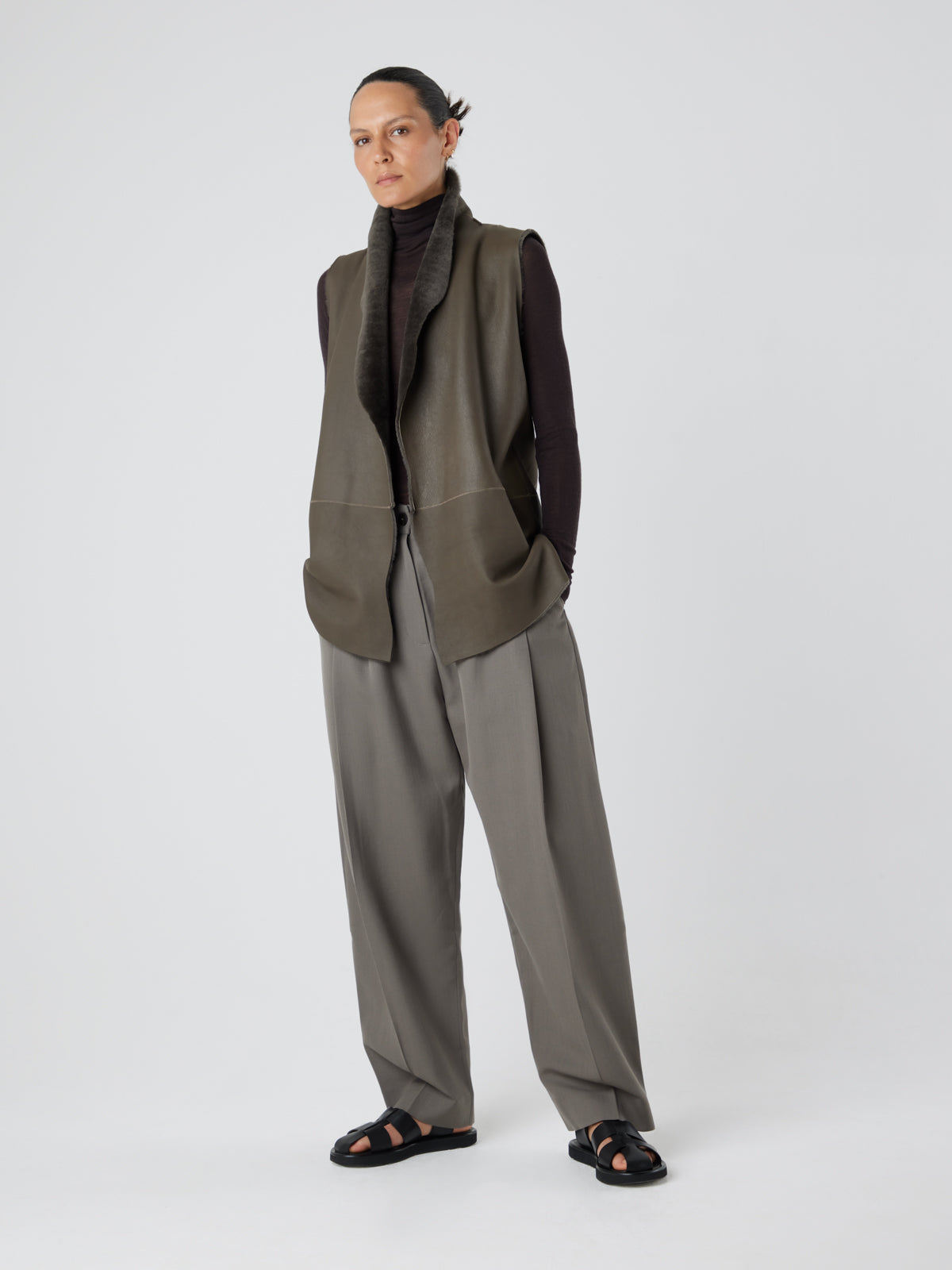 Natural Edge Storm Green Mid Length Shearling Gilet - model full length leather out