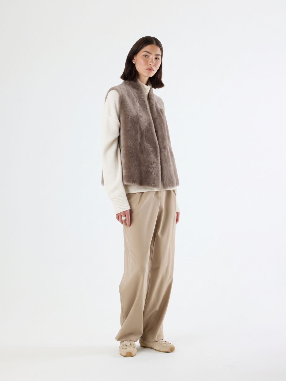 woman wearing natural edge taupe shearling gilet by gushlow & cole
