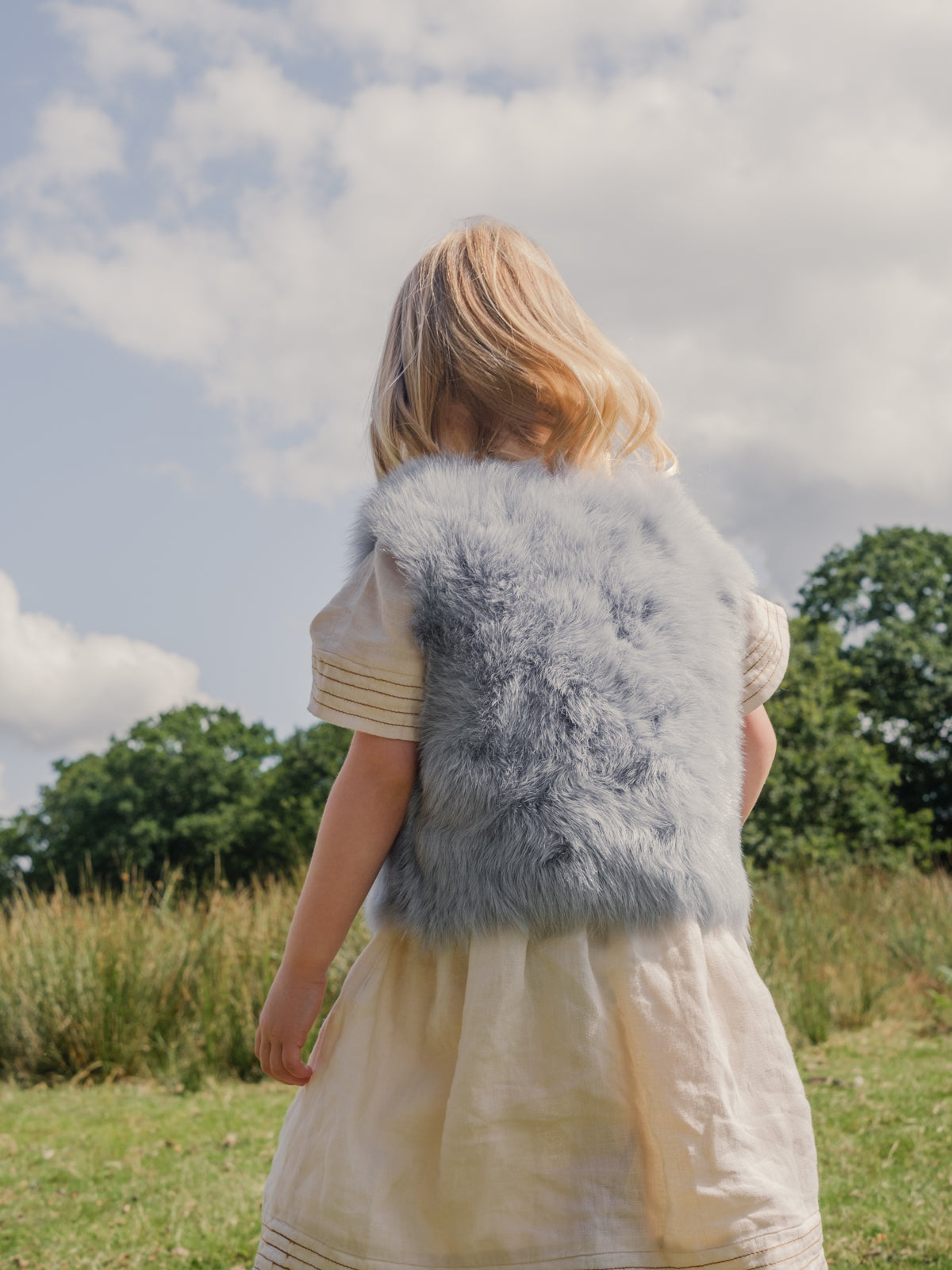 Pale Blue Kids Toscana Shearling Gilet | Kids | Gushlow & Cole- back on model