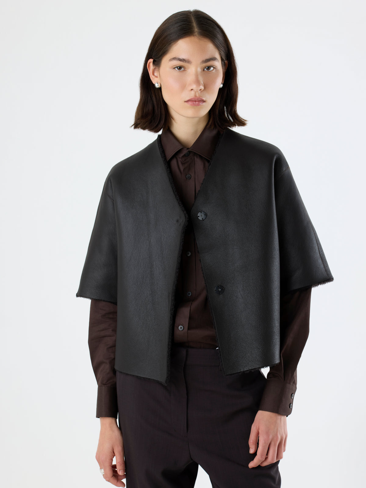 woman wearing reversed short-sleeve dark brown Shearling Cardigan by gushlow & Cole