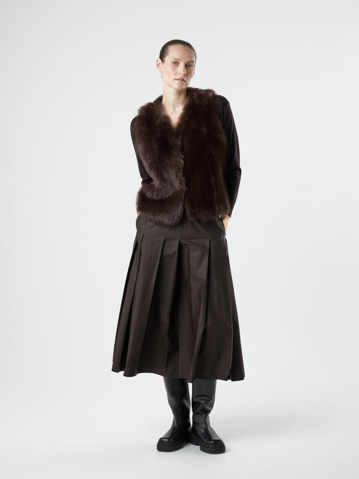 woman wearing Two Button Brown Shearling Vest by Gushlow & Cole over brown jumper on white background