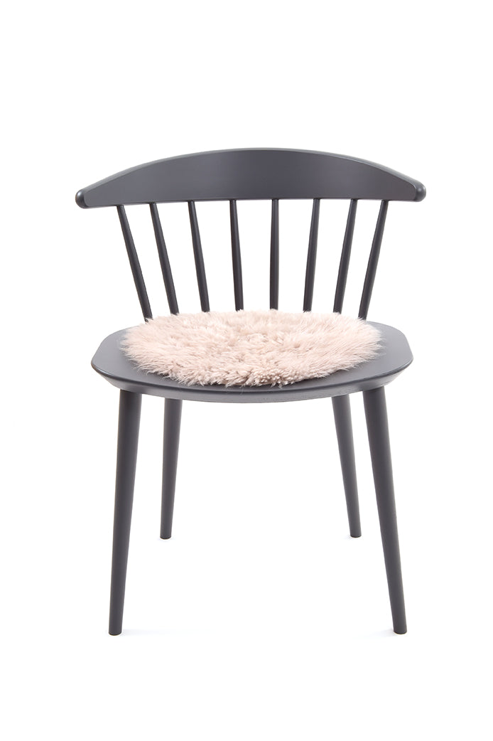 Curly Sheepskin Seat Pad in Beige chair