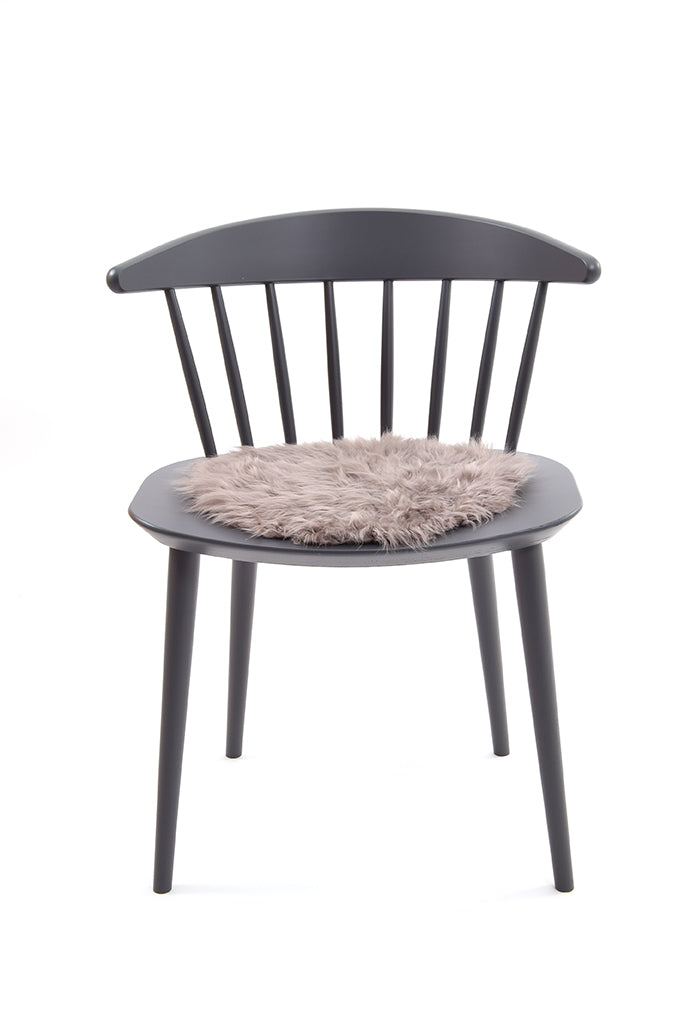 Curly Sheepskin Seat Pad in taupe chair