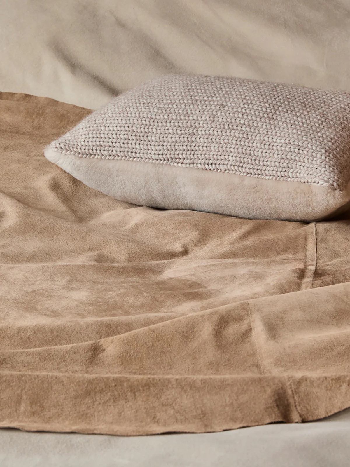 Beige Shearling and Knit Square Cushion | Home | Gushlow & Cole - cushion on bed with throw