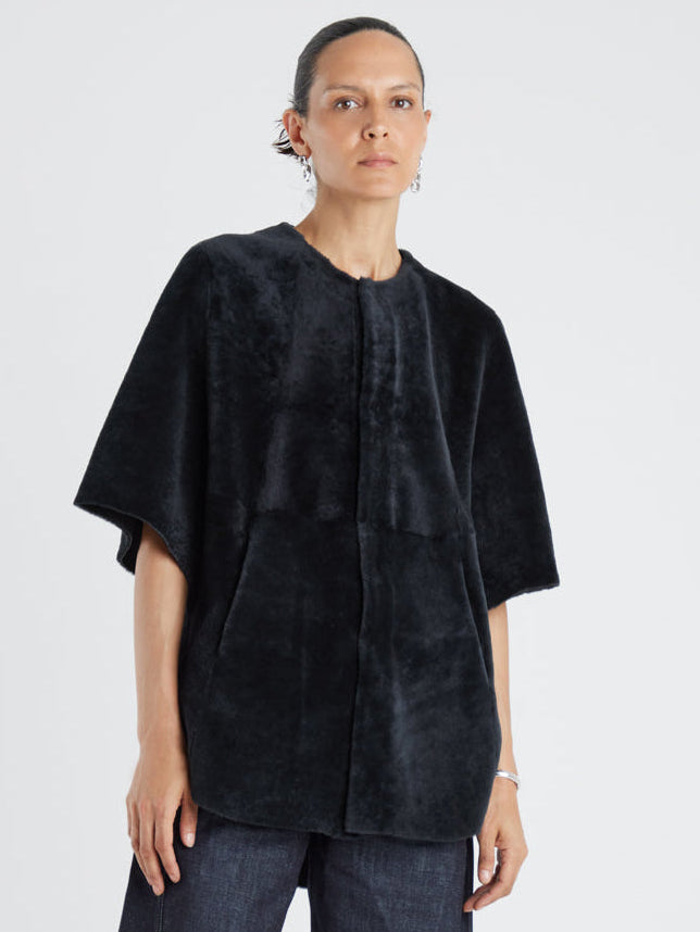 Black Collarless Shearling Cape | Womens | Gushlow & Cole- model full length
