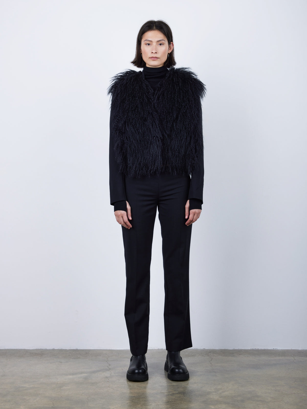 Black Mongolian Shearling Gilet | Womens | Gushlow & Cole-model wearing gilet front on