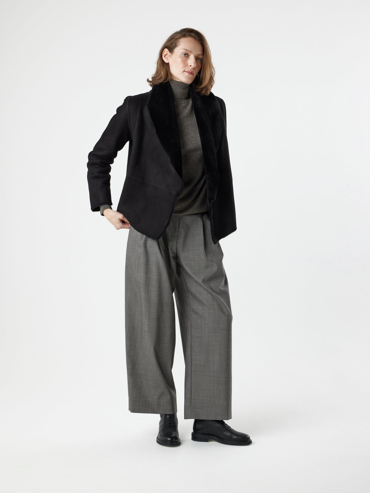 woman wearing Black Blanket Shawl Shearling Jacket by gushlow & cole on white background 