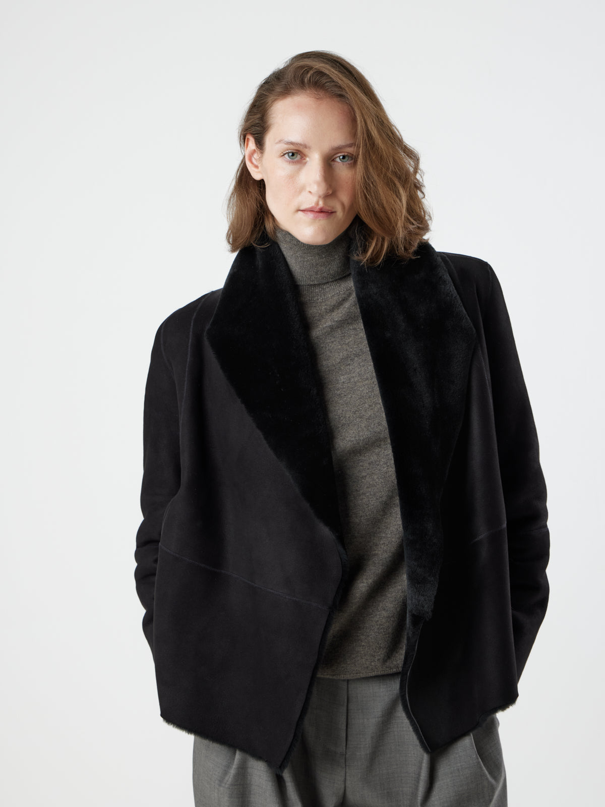woman wearing Black Blanket Shawl Shearling Jacket by gushlow & cole on white background