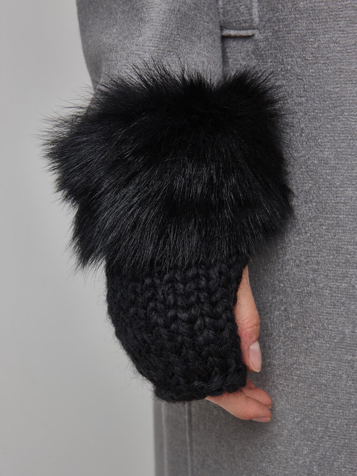 woman wearing Black Shearling and Knit Mittens by Gushlow & Cole over grey coat
