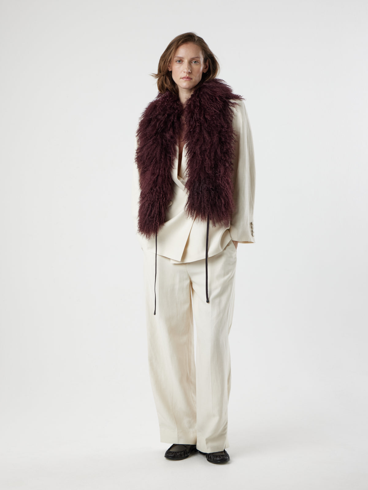woman wearing Burgundy Mongolian Shearling Shawl Scarf by gushlow & cole on white background