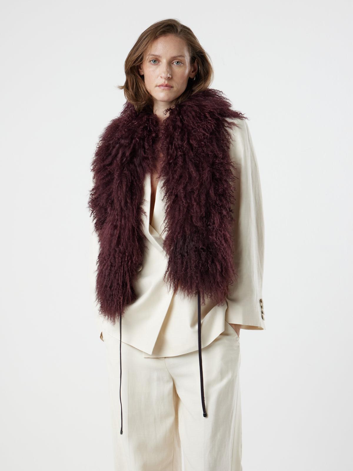 woman wearing Burgundy Mongolian Shearling Shawl Scarf by gushlow & cole on white background