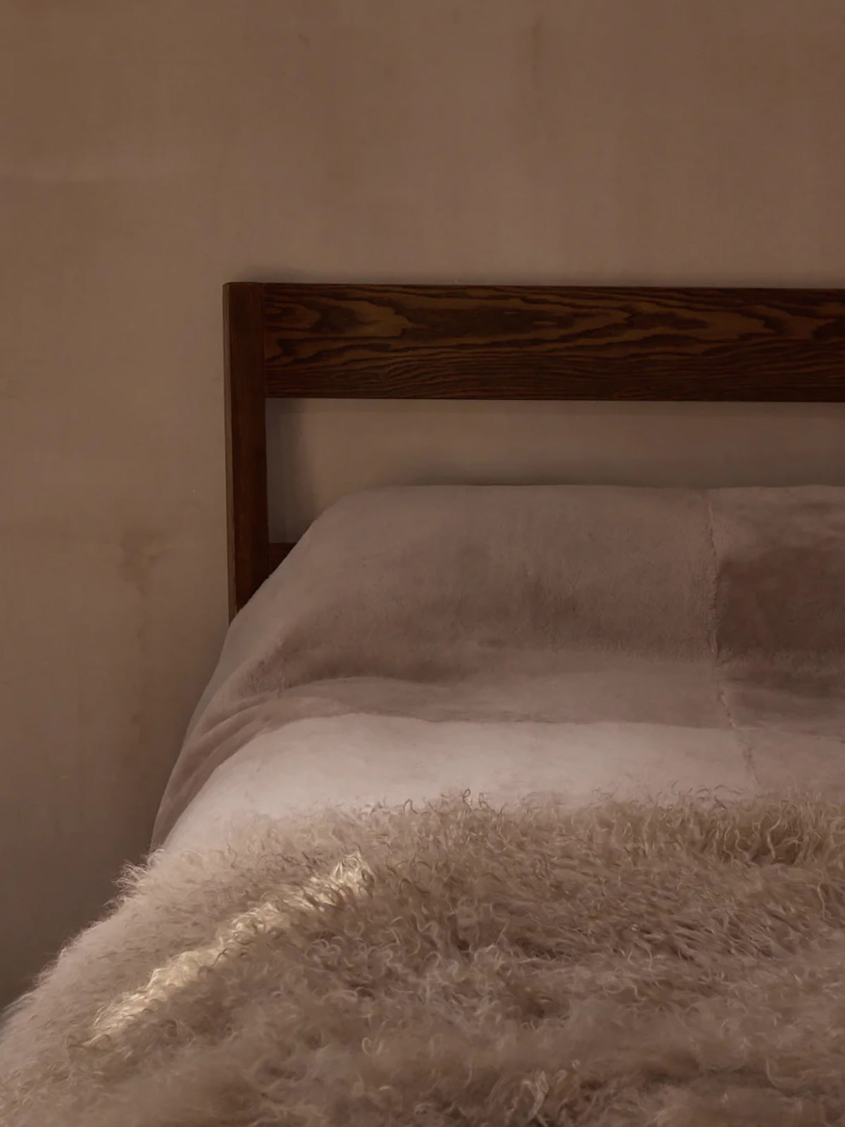 Camel Mongolian Shearling Throw | Home | Gushlow & Cole - lifestyle image of throw on bed