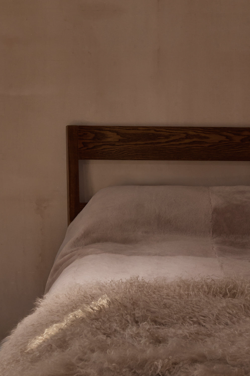 Camel Mongolian Shearling Throw | Home | Gushlow & Cole - lifestyle image of throw on bed