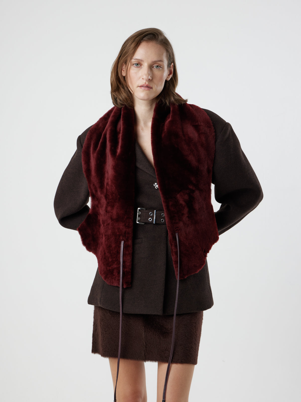 woman wearing cherry red shearling shawl scarf by gushlow & cole