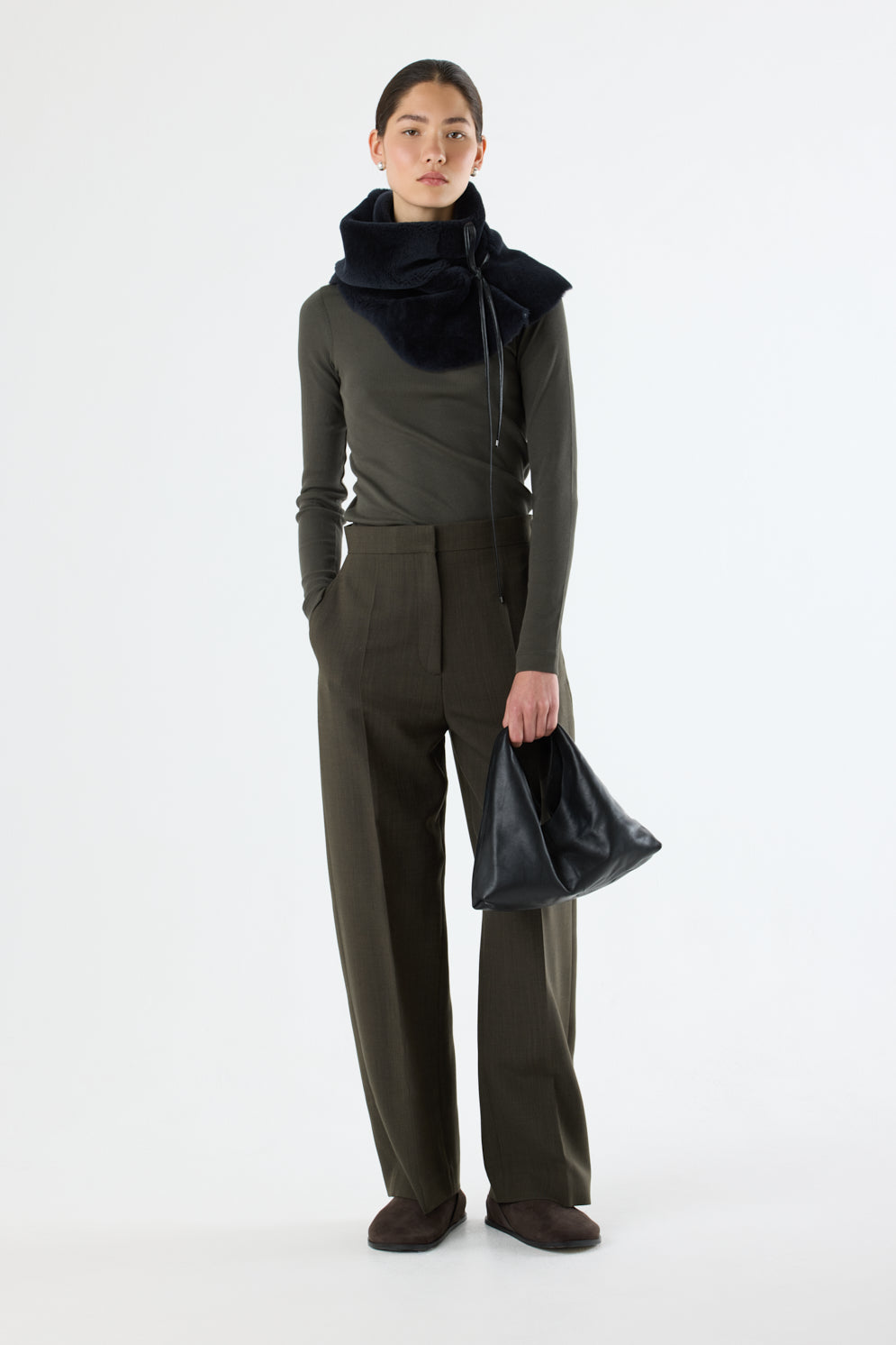 Clara Small Black Leather Shoulder Bag | Bags | Gushlow & Cole - model full length holding bag