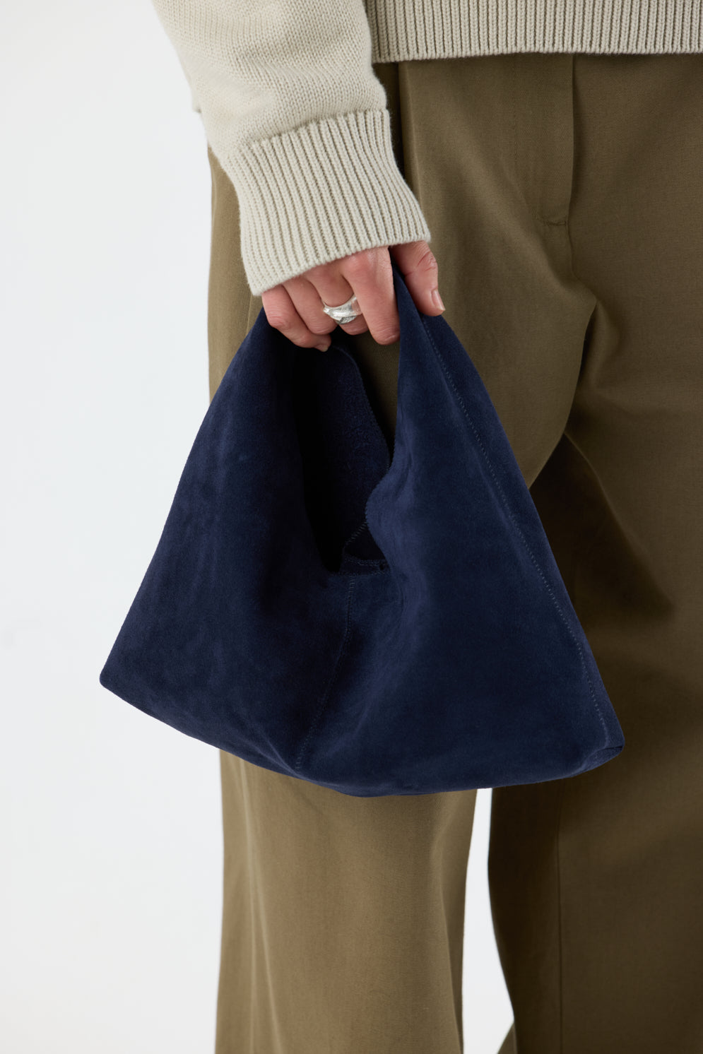 Clara Small Navy Blue Suede Shoulder Bag | Bags | Gushlow & Cole - crop model holding bag