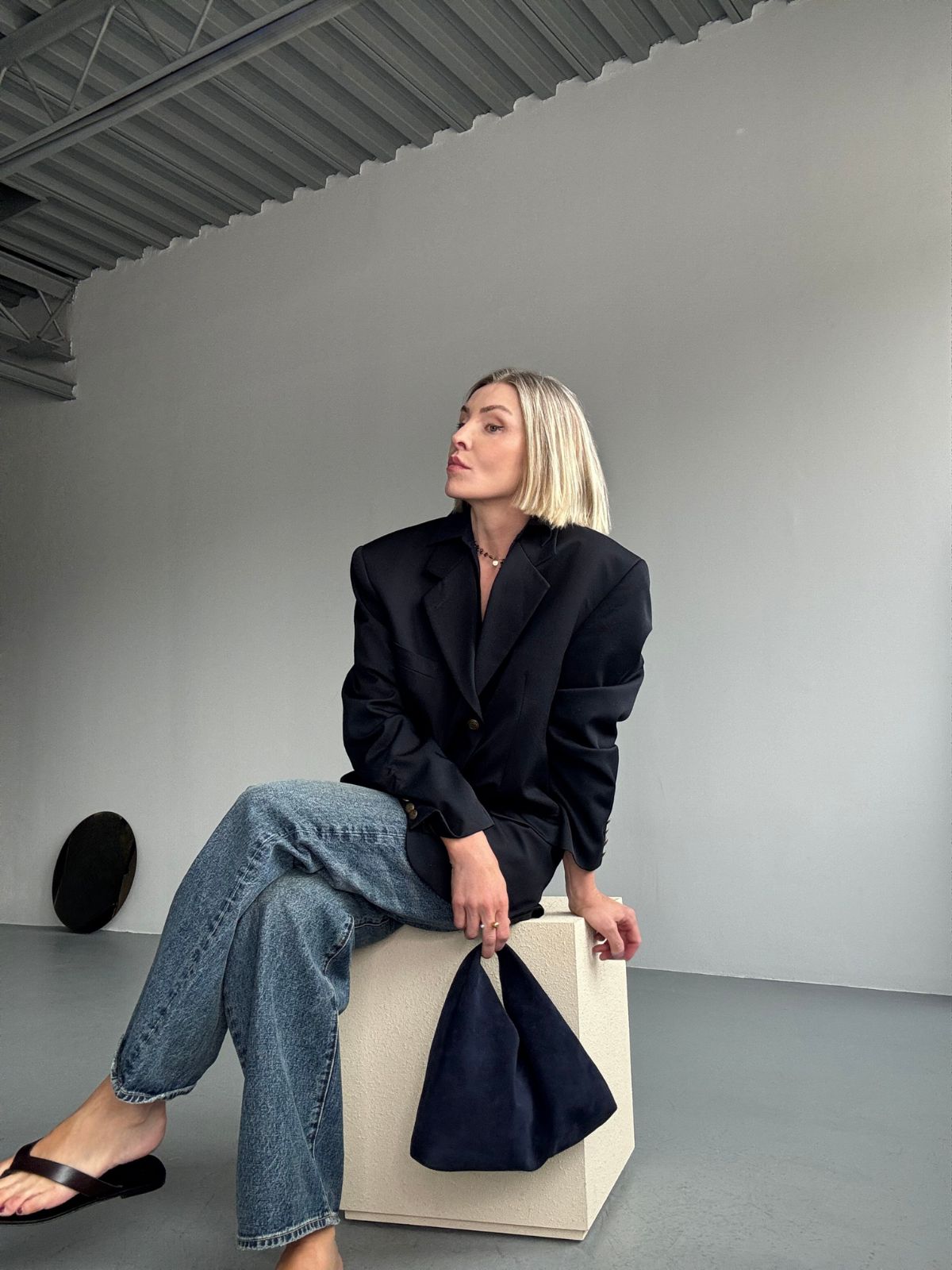 Yara Svalek holding Clara Small Navy Blue Suede Shoulder Bag | Bags | Gushlow & Cole 
