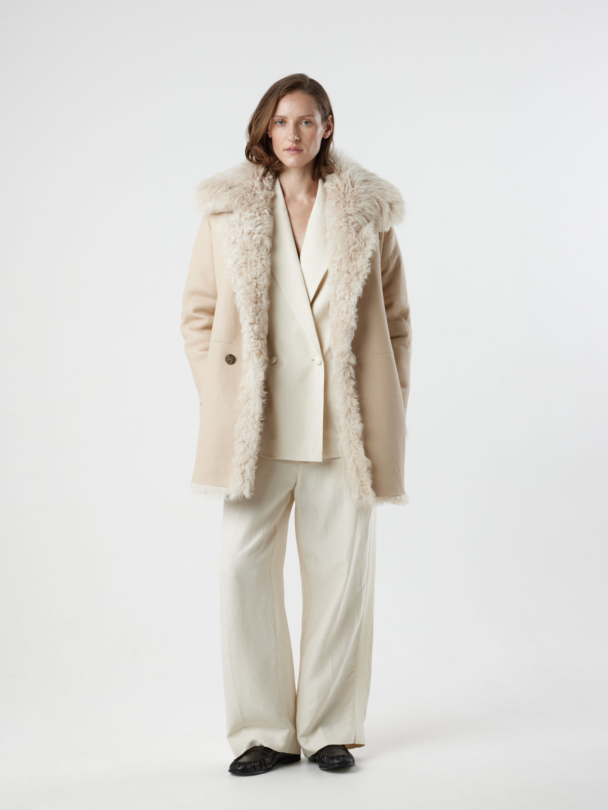 women wearing reversed Cream Relaxed Fit Curly Shearling Coat by gushlow & cole