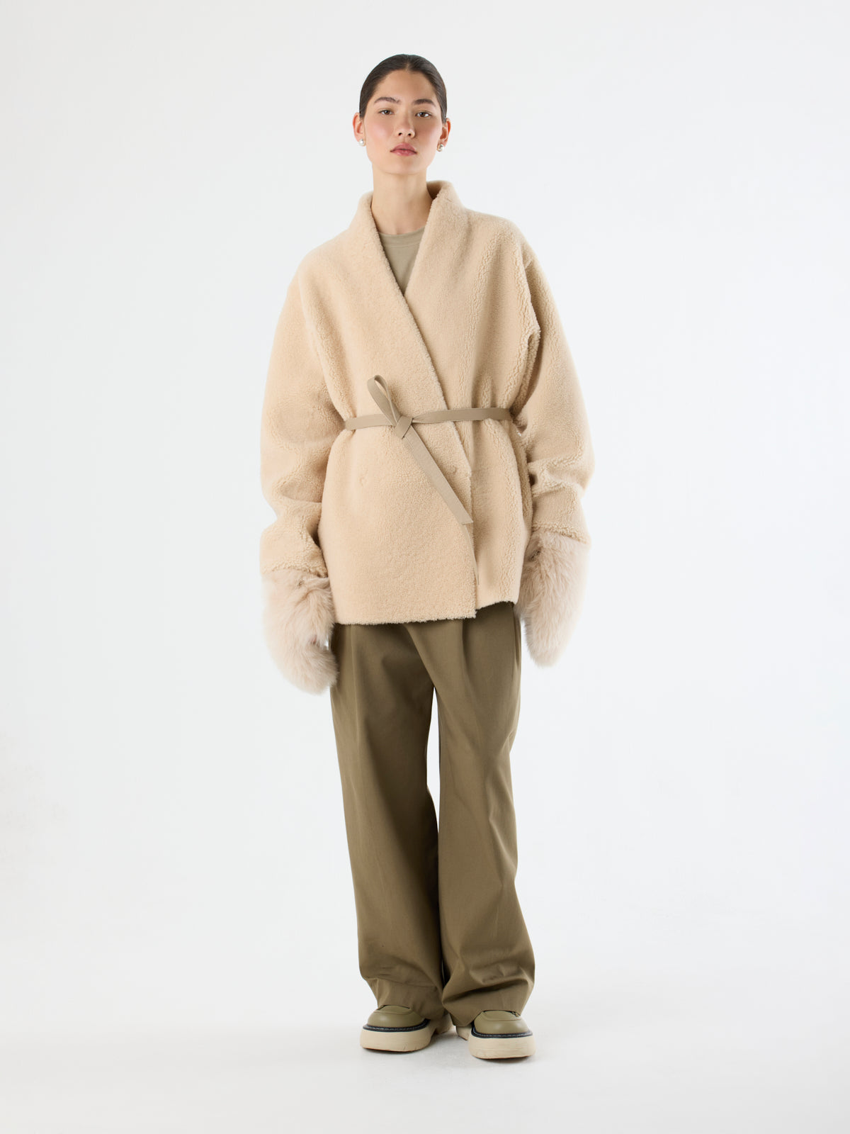 women wearing Cream Touchscreen Shearling Mittens and cream Collarless Shearling Wrap Jacket by Gushlow & Cole