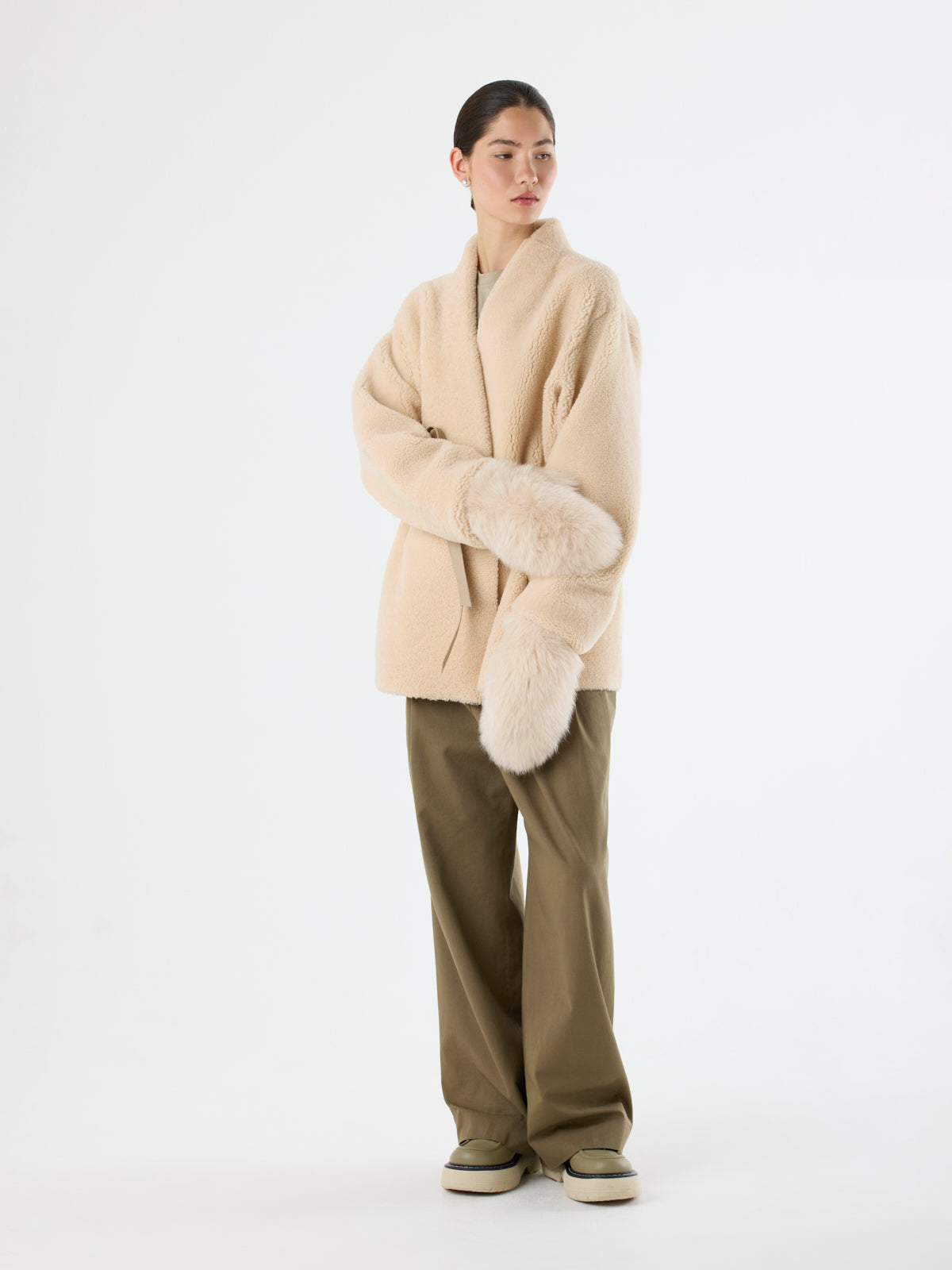 women wearing Cream Touchscreen Shearling Mittens and cream Collarless Shearling Wrap Jacket by Gushlow & Cole