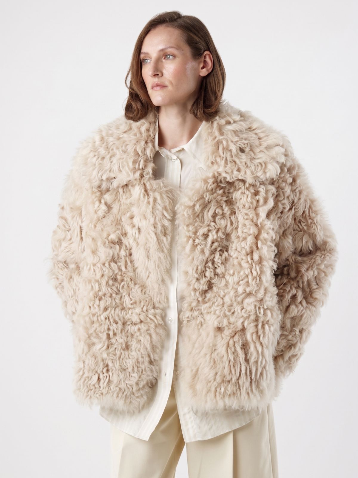 woman wearing Cream Relaxed Fit Curly Shearling Jacket by gushlow & cole / curly sheepskin Jacket