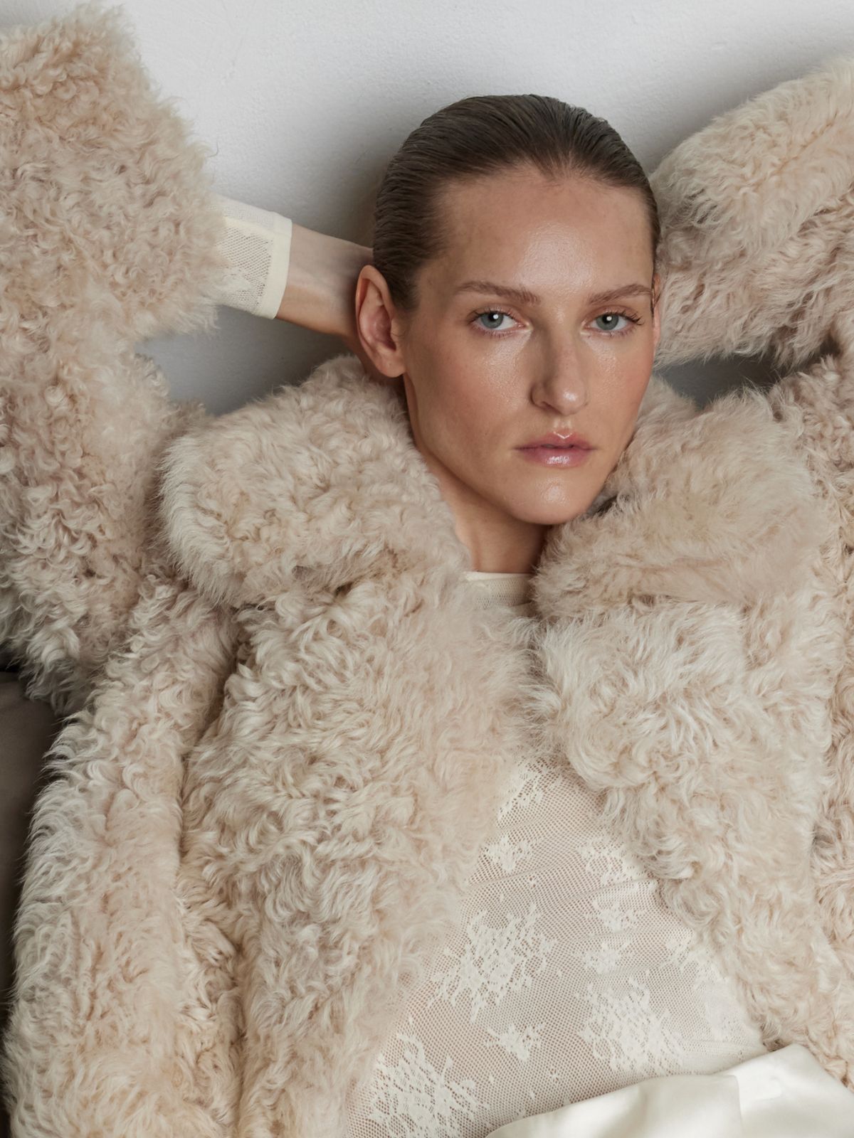 woman wearing Cream Relaxed Fit Curly Shearling Jacket by gushlow & cole / curly sheepskin Jacket