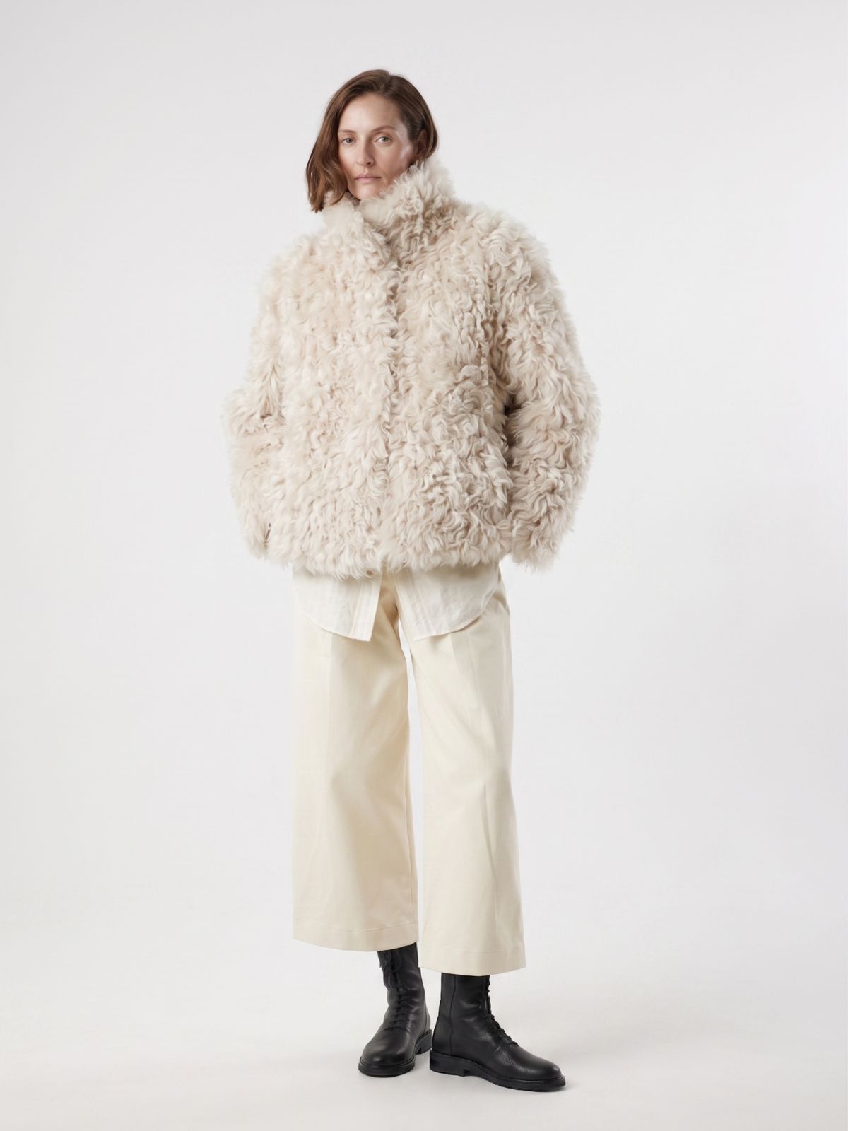 woman wearing Cream Relaxed Fit Curly Shearling Jacket by gushlow & cole / curly sheepskin Jacket