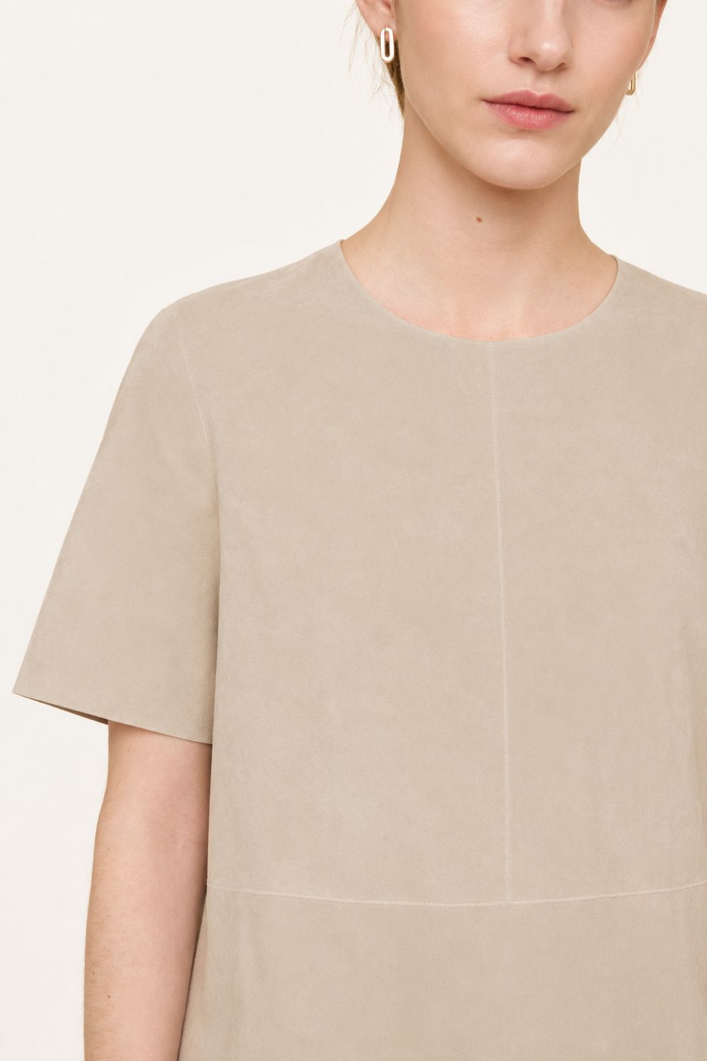 woman wearing cream suede t shirt top on white background by gushlow & cole